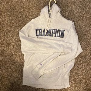 White champion hoodie with black logo in good condition.